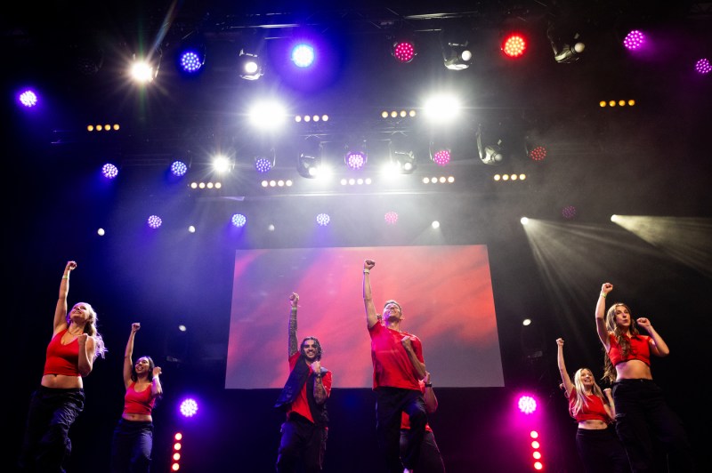 Students perform on stage at the London convocation