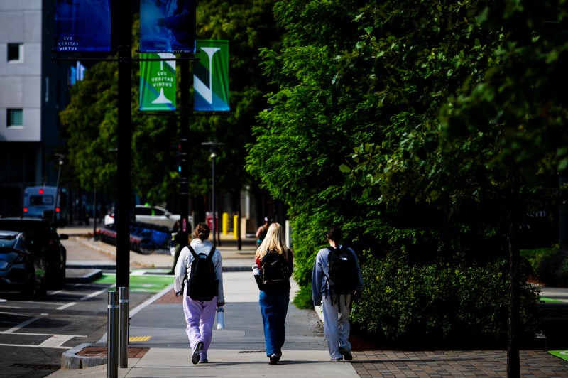 Students walk through campus.
