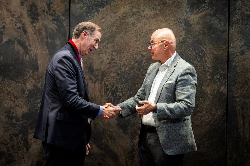 Charles Hillman and President Aoun shake hands.