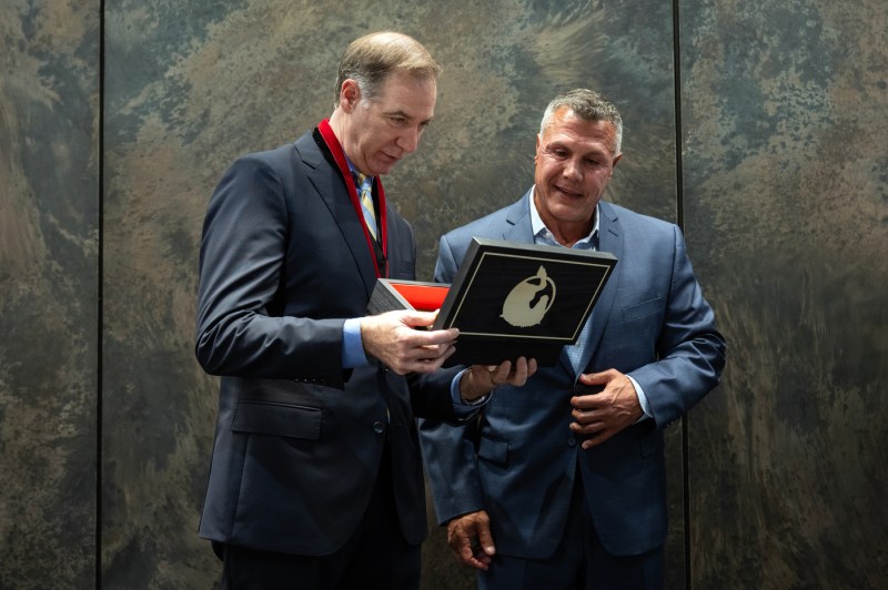 Charles Hillman and Todd Manganaro open the cigar box.