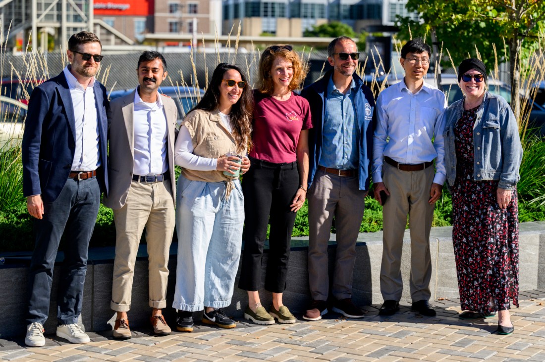 Group of attendees pose together outdoors at the City of Boston Air Grant event in Allston, Massachusetts.