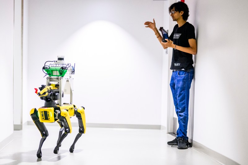 A student collects data on a robot.