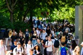 Crowds of students walk through Northeastern&#039;s Boston campus in between classes.