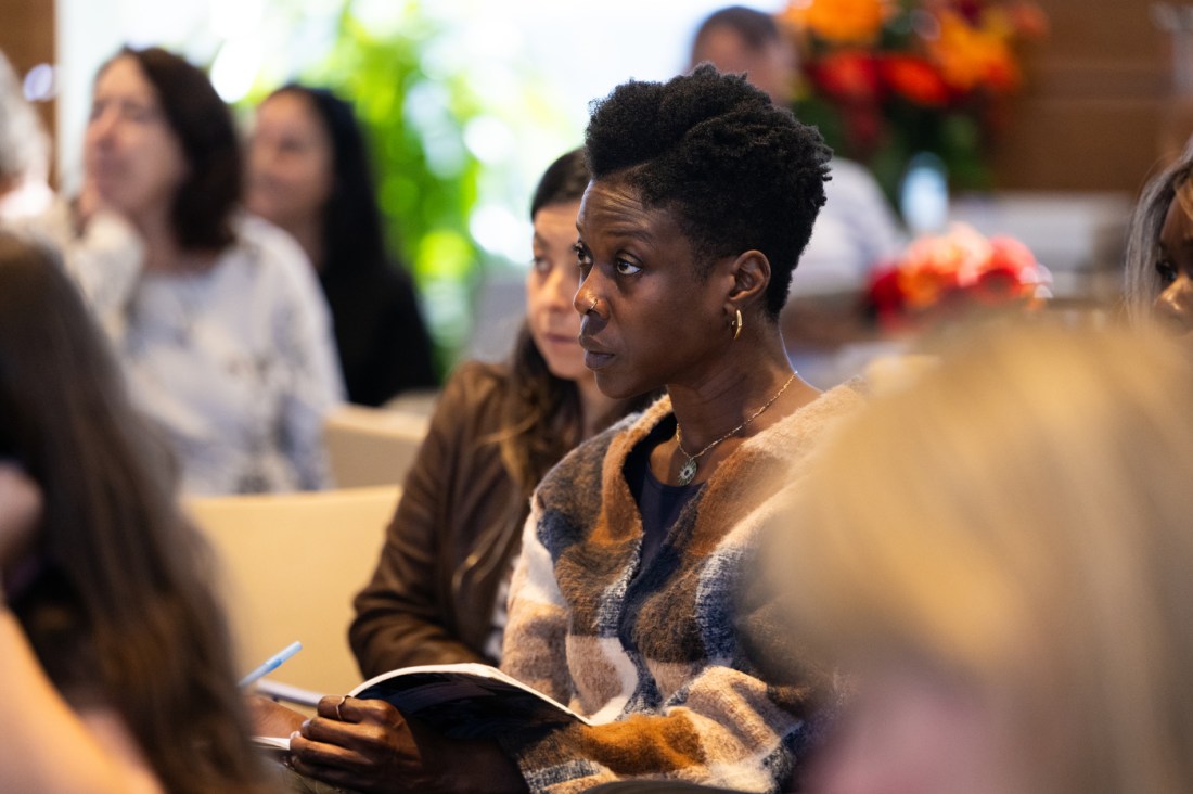 An audience member listening during a panel discussion at the Social Media Summit. 