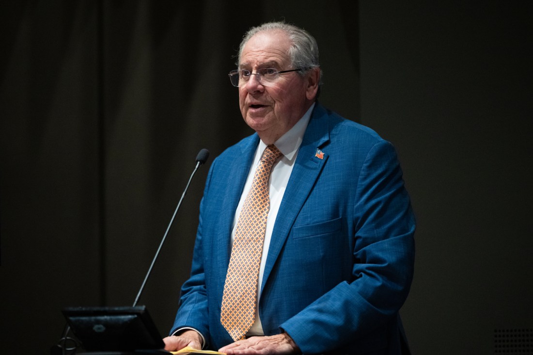 Robert DeLeo speaks at a podium during the Civic Experience: From the Classroom to the Campaign Trail lecture at Northeastern University.